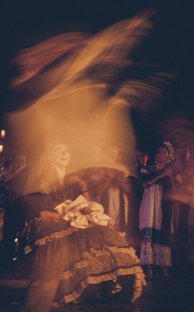 Soft hazy picture of a laughing woman dressed in traditional clothes at Day of the Dead, Mexico