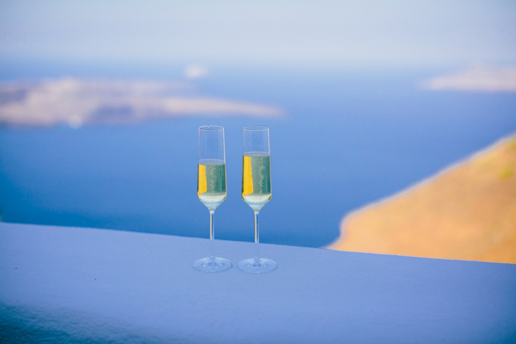 Chilled champagne rests on the caldera at Iconic Santorini in Imerovigli.