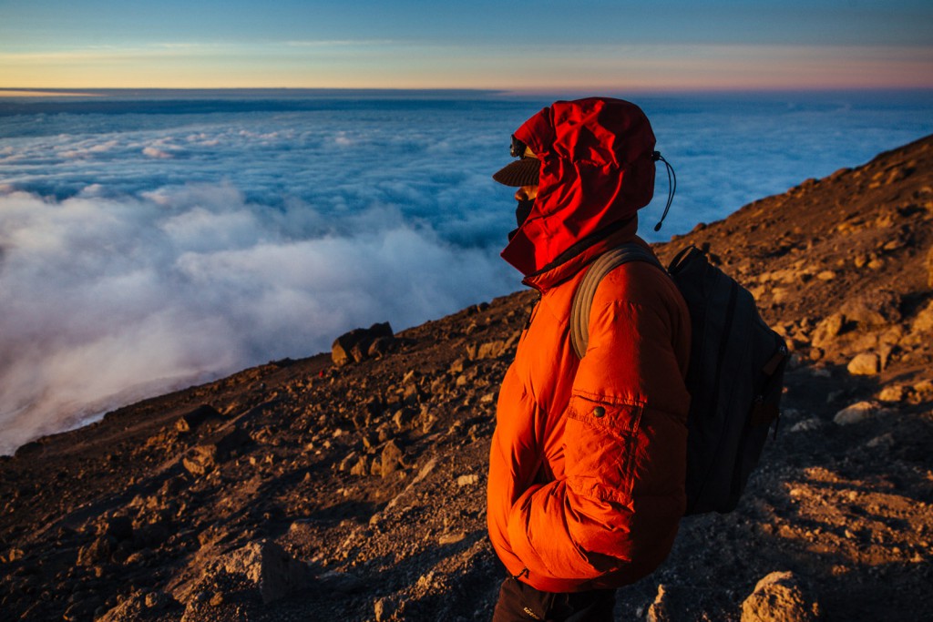 The sun sinks over an edge of Kibo, Kilimanjaro’s steepest ridge – with our camp for six days amid the mountain moorland.