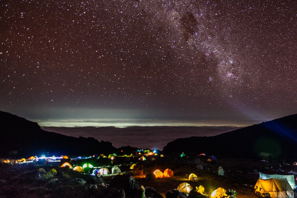 At nightfall each campsite on Mt. Kilimanjaro is aglow with clusters of jewel-like tents.