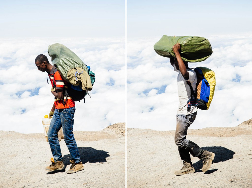 Porters walk on a ridge above the clouds on Mount Kilimanjaro – often hauling as much as 30kg.