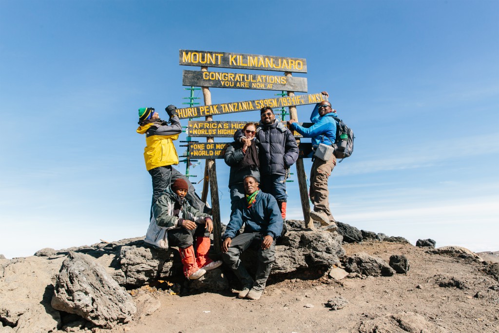 The author and photographer, Tanveer Badal, with their summit team on Uhuhu Point – Kilimanjaro’s pinnacle and Africa’s rooftop.