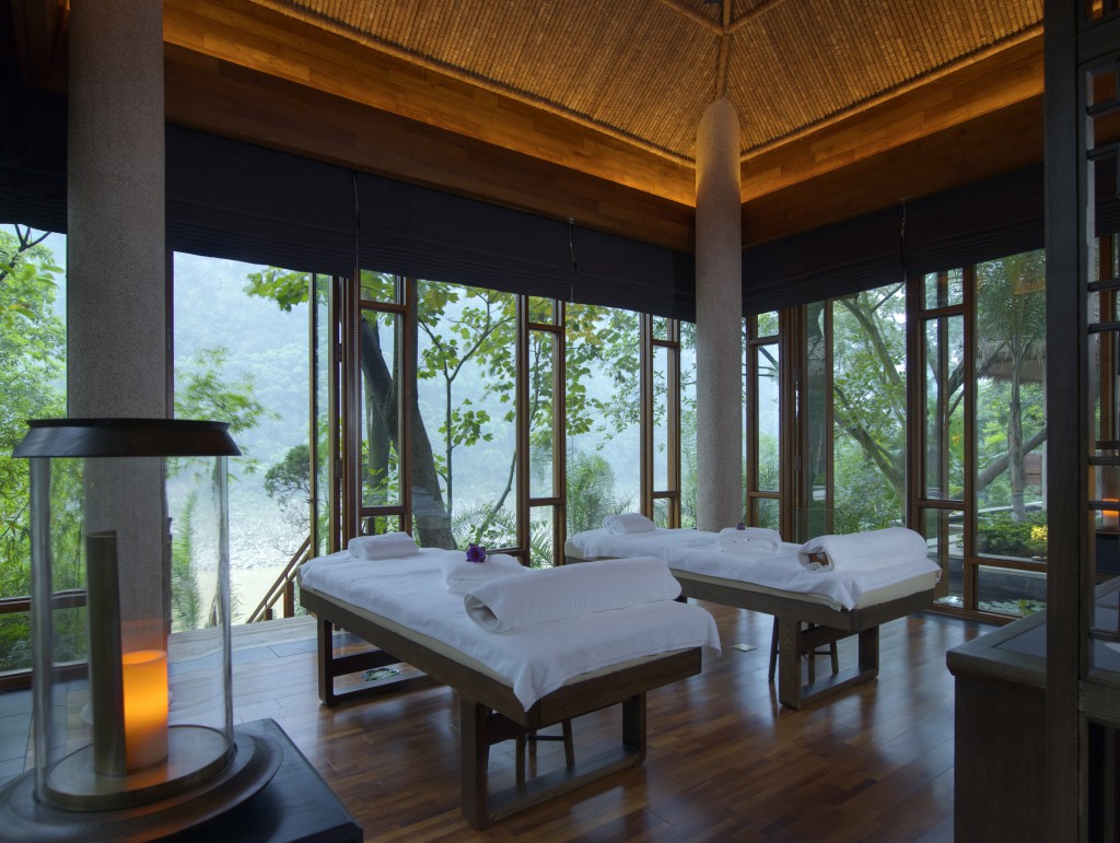 Two sumptous massage tables in a room open on all sides overlooking a forest at Brilliant Resort & Spa Chongqing China Wellness Retreat