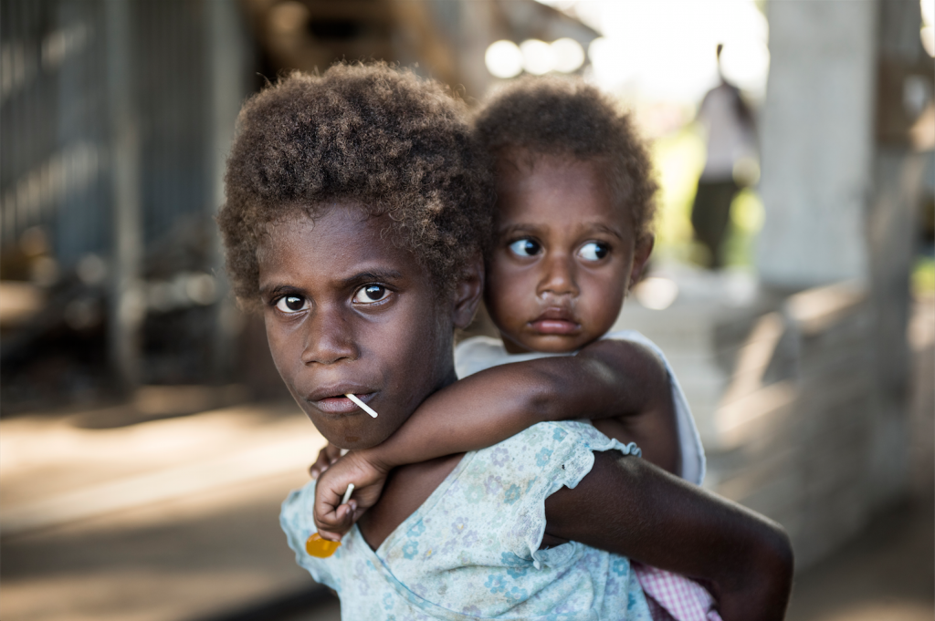 Siblings wait for treatment at a make-shift medical station, Vanuatu. Photo by Thai Neave