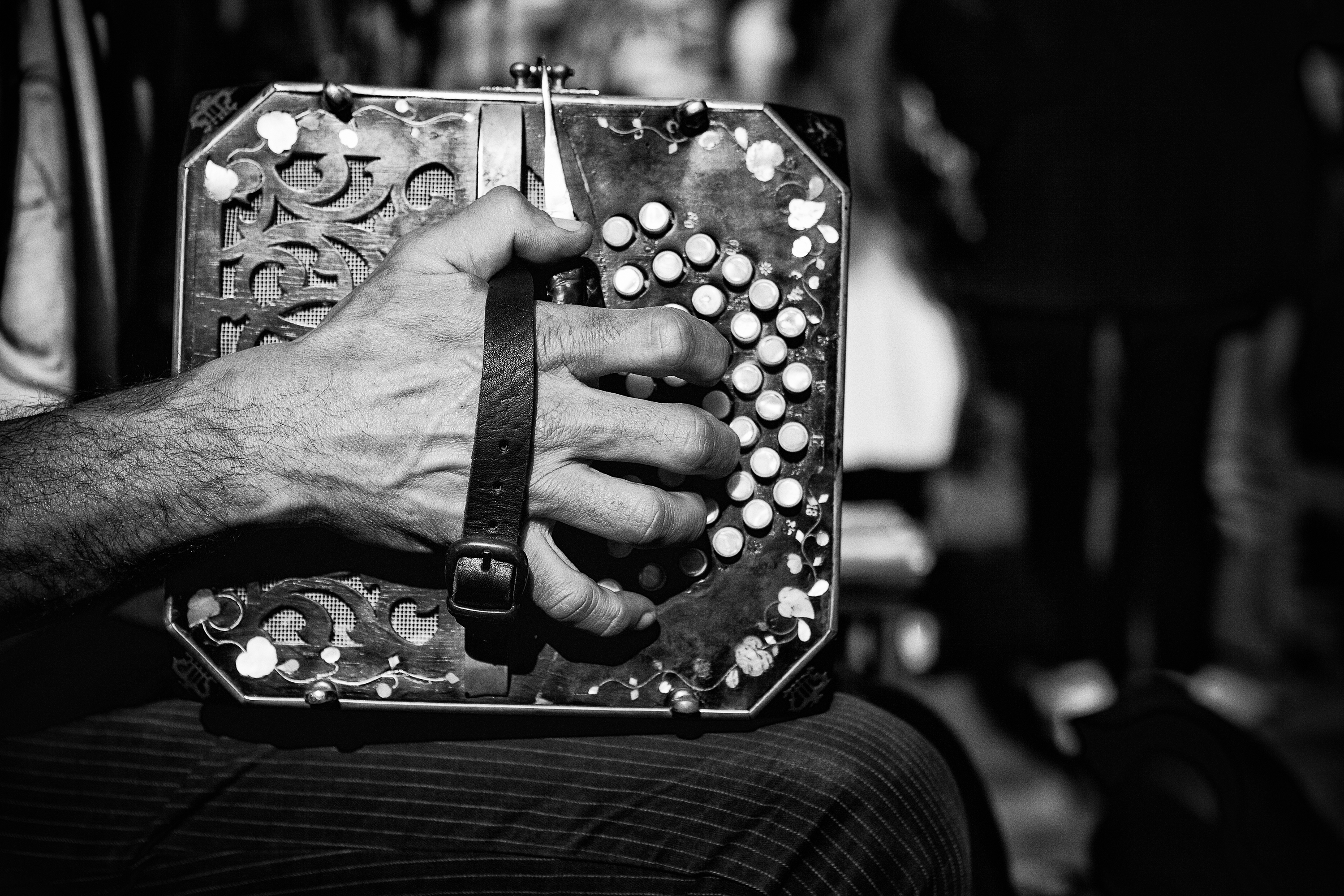 Close up of a hand playing the bandoneon