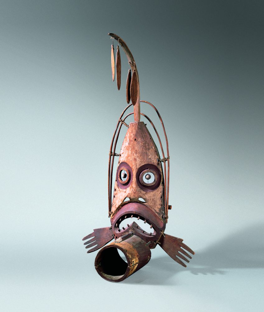 A Yup'ik mask made of painted wood and leather ties