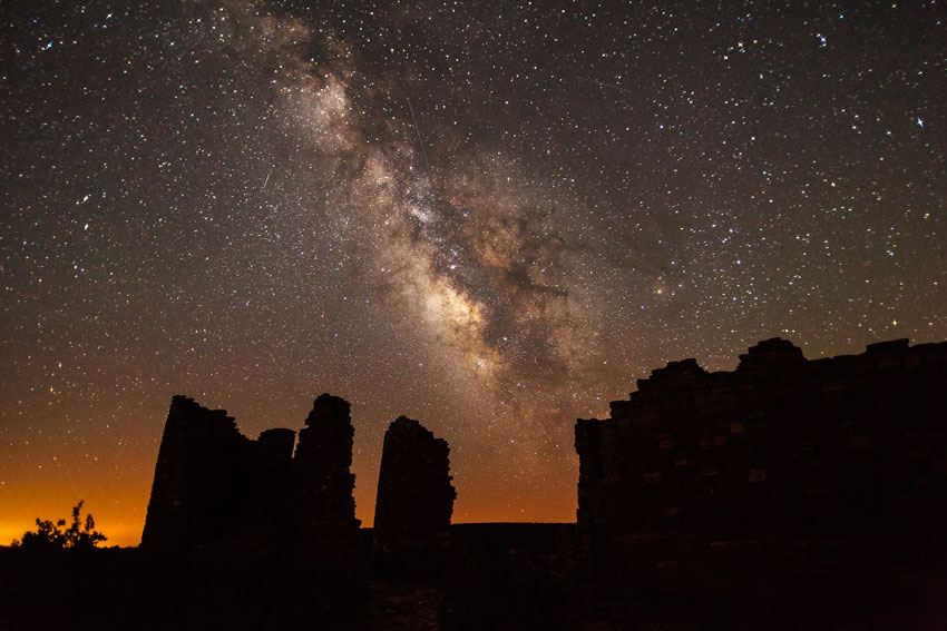 A night view through Puebloan village ruins of the vast Milky Way at night, Hovenweep, USA