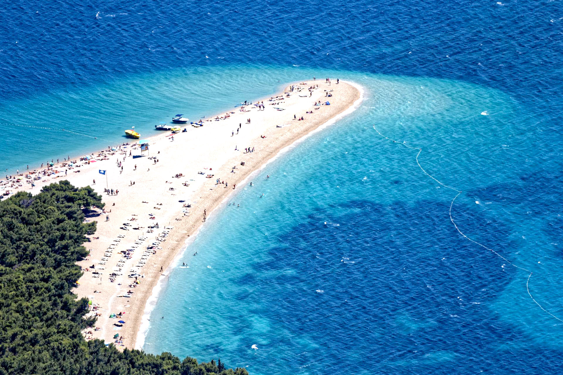 Aerial view of a large sandspit extending out into the ocean, Zlatni Rat Beach, Croatia.