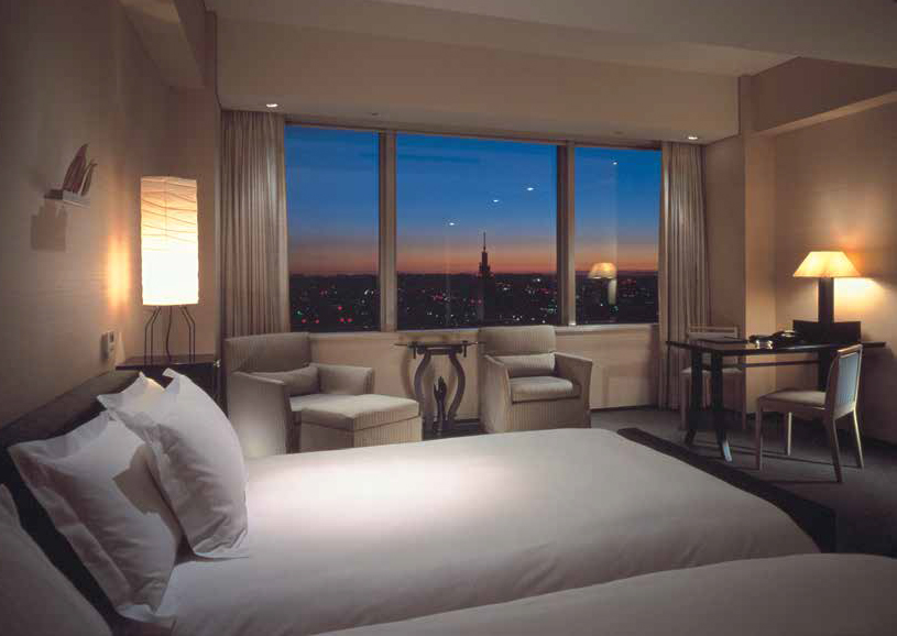 A twin-bedded room at the Park Hyatt overlooking the night skyline, Toyko