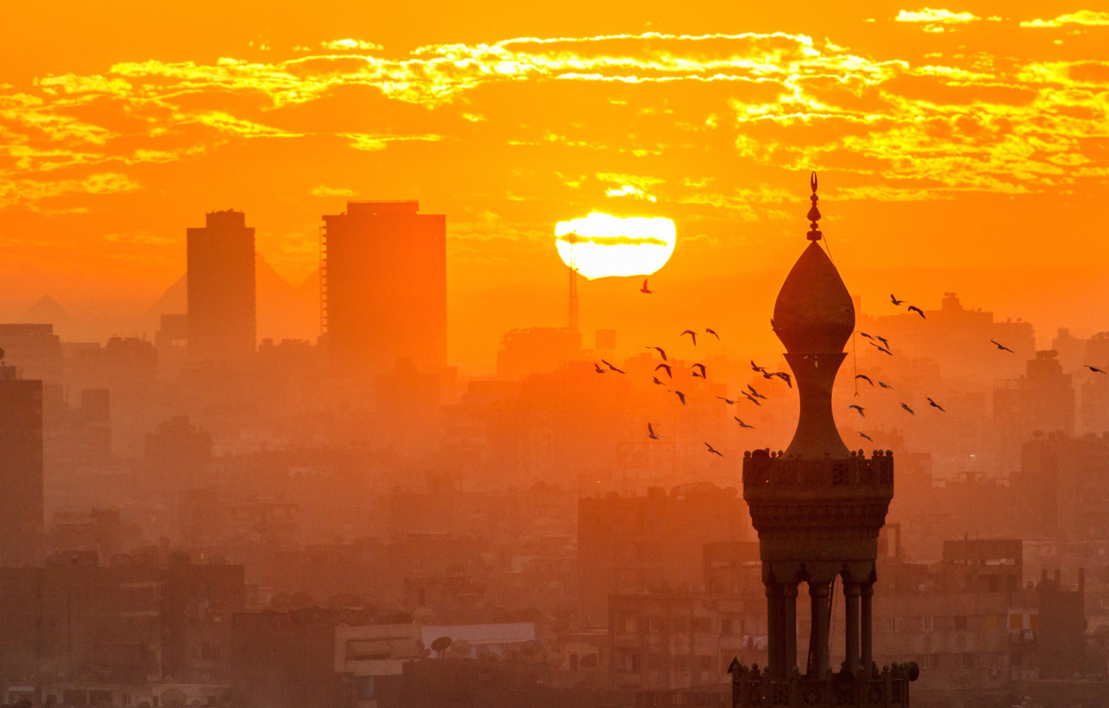 An orange sunset over Cairo