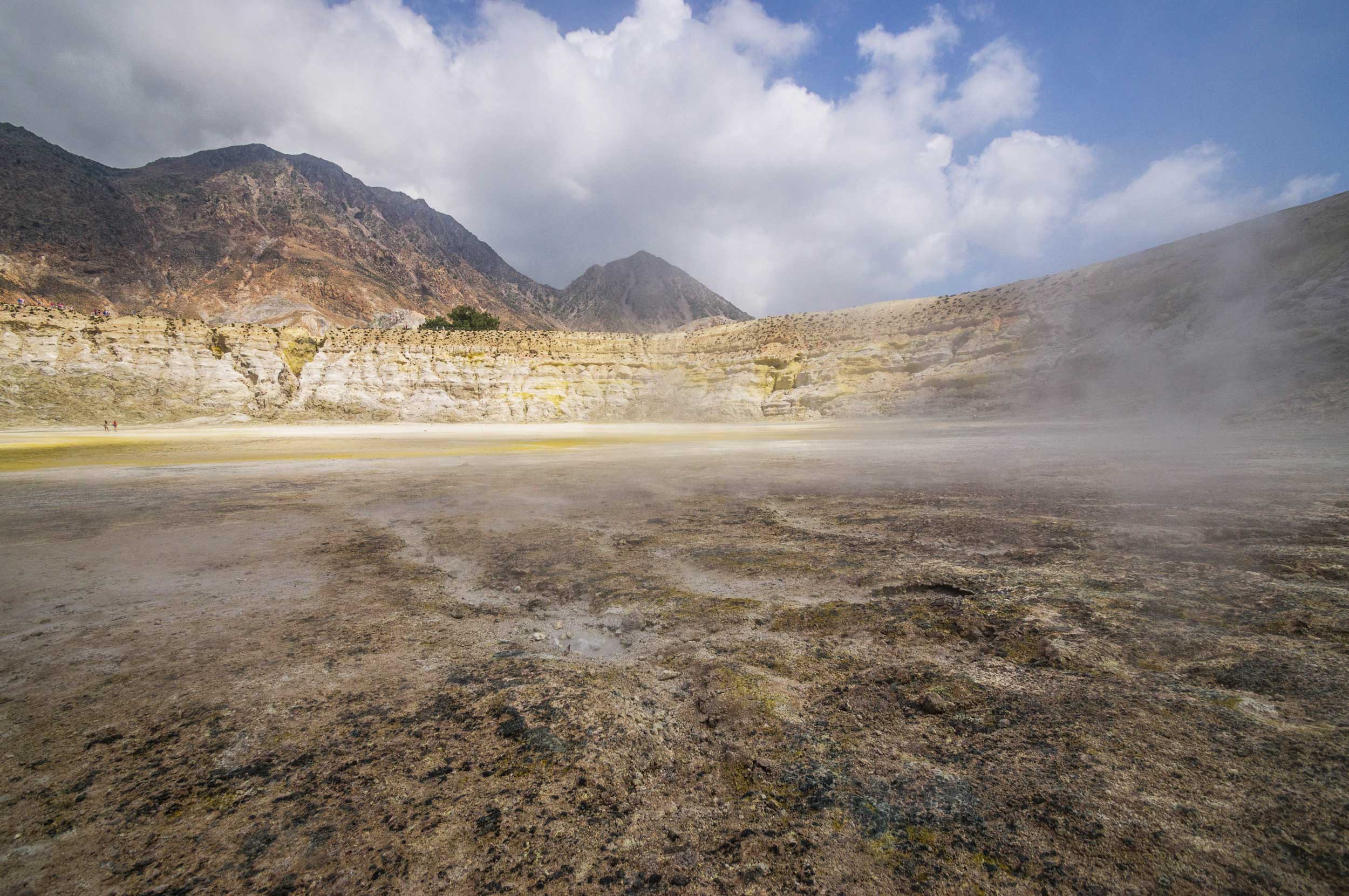 Vapour rising from a flat, yellow sulphurous crater, Greece