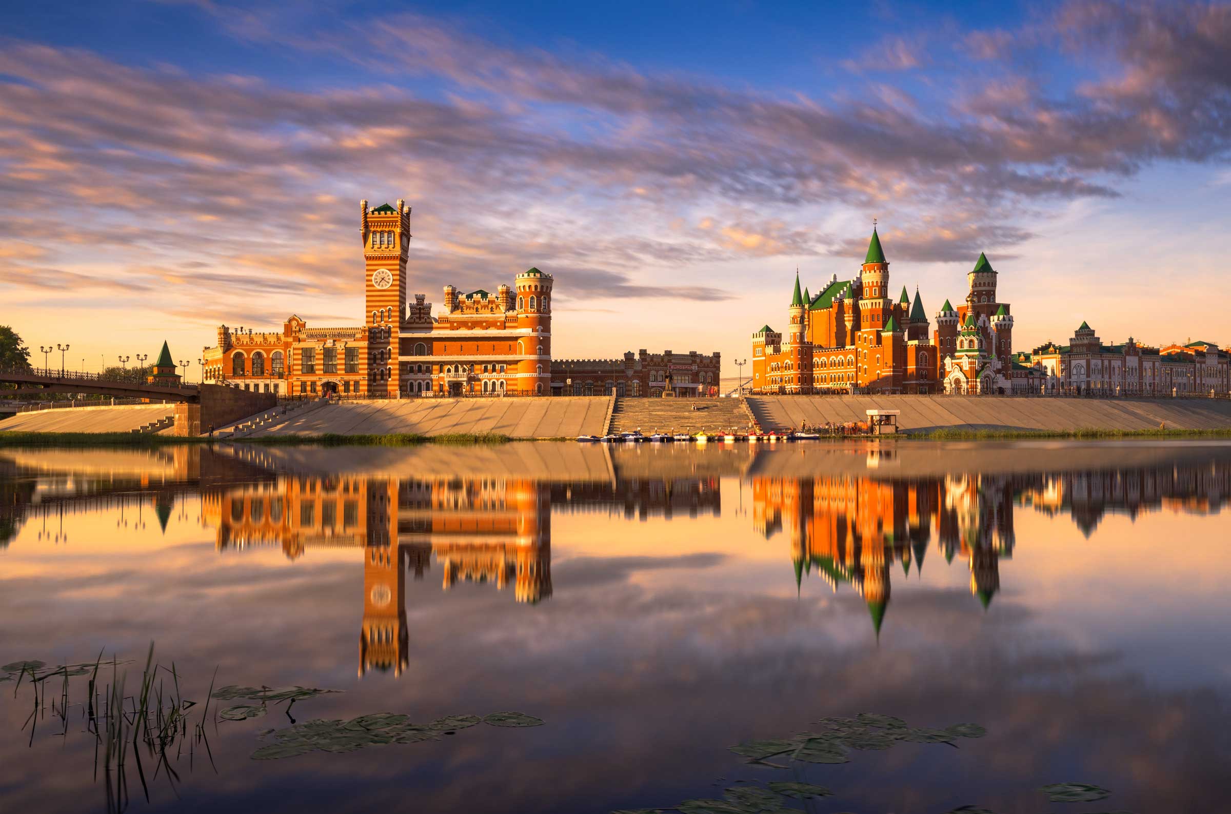 Stately medieval buildings on the banks of a river in Russia